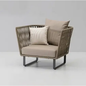 Close up detail of woven rattan weave texture on modern U-shape outdoor sofa set garden furniture
