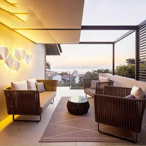 Close up of woven rattan material texture on modern outdoor sofa set cushioning and frame detail