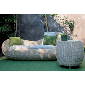 Modern rattan garden sofa set showcasing woven all-weather material texture and brown finish detail