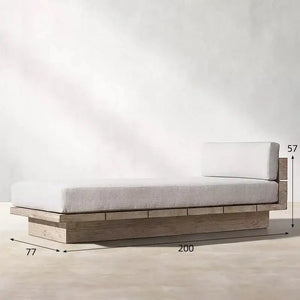 Teak outdoor sofa set showcasing waterproof cushions and natural wood grain detail in garden setting.