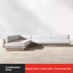 Teak outdoor sofa set showing natural wood grain texture and waterproof cushion material detail