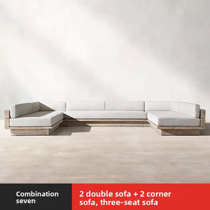 Teak outdoor sofa set showing waterproof cushion detail and natural wood grain texture