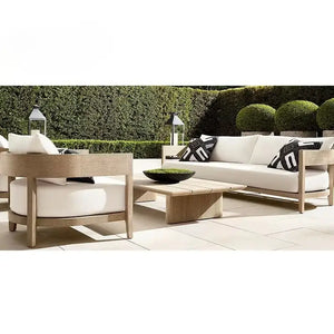 Teak wood outdoor sectional sofa showcasing dark gray modular cushions and natural wood grain detail
