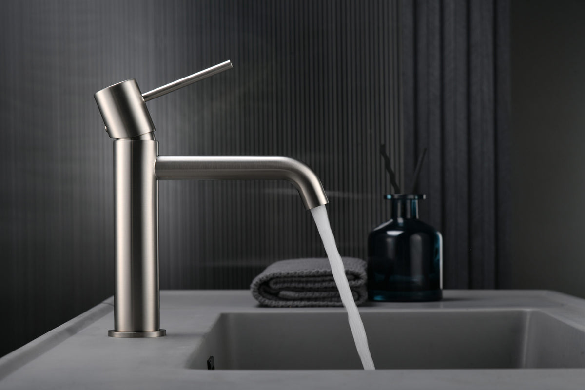 Monza Brushed Nickel Single Lever Sink Faucet, in a bathroom setting
