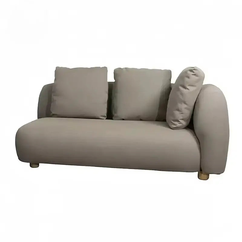 Close up of waterproof cushion fabric on modern gray outdoor patio sofa showing fade resistant material quality