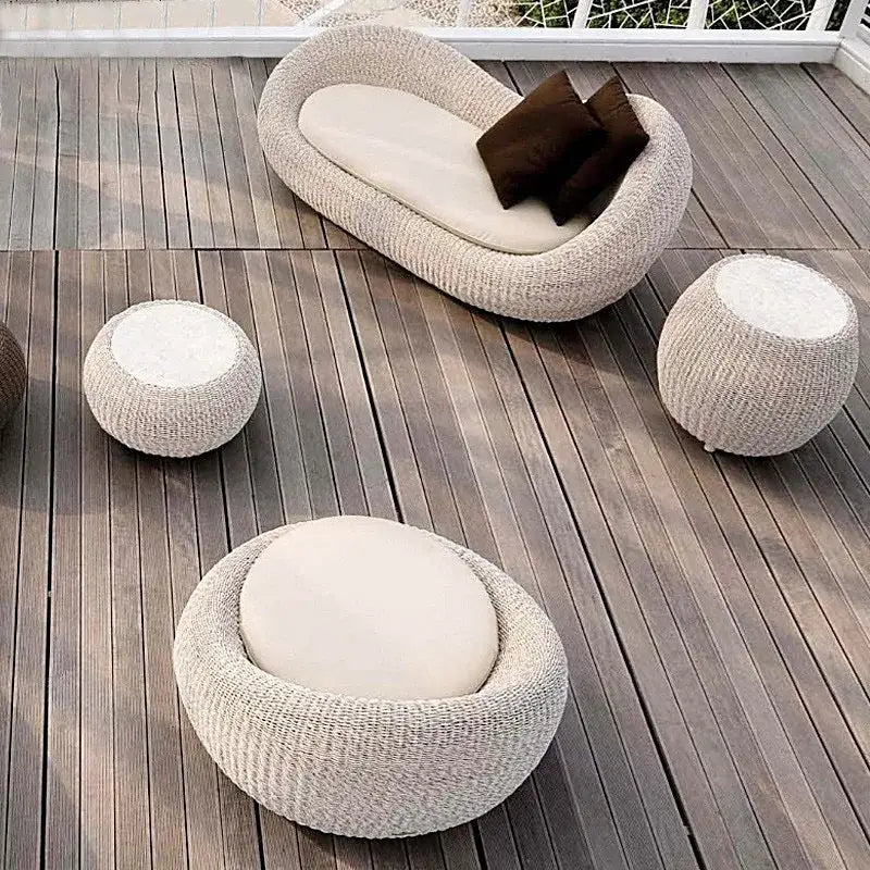 Close up of woven all weather rattan material on modern garden sofa set showing texture and durability