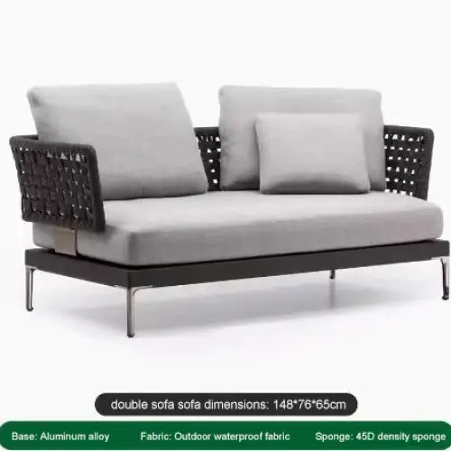 Close-up of woven rattan texture and aluminum frame on modular outdoor sofa set cushions.