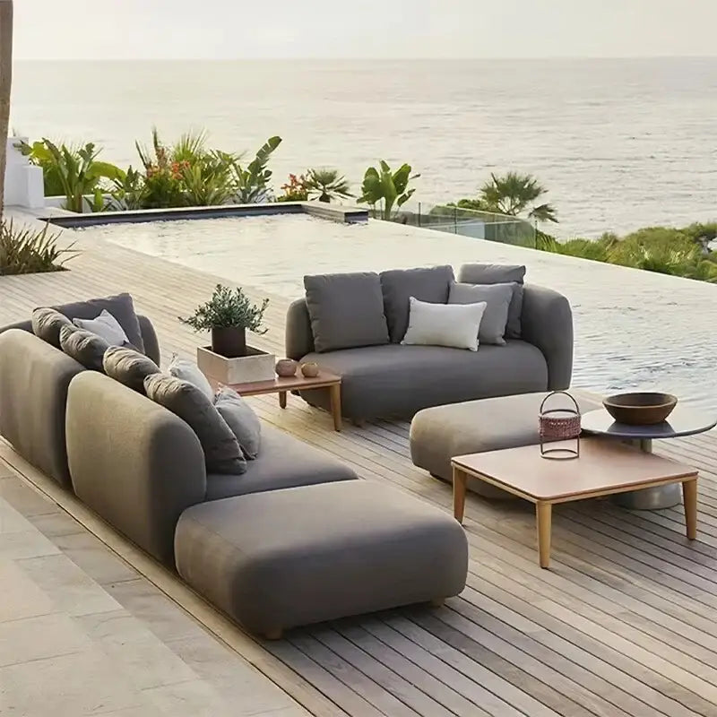 Modern gray outdoor patio sofa set displaying waterproof cushion material and fade resistant fabric up close