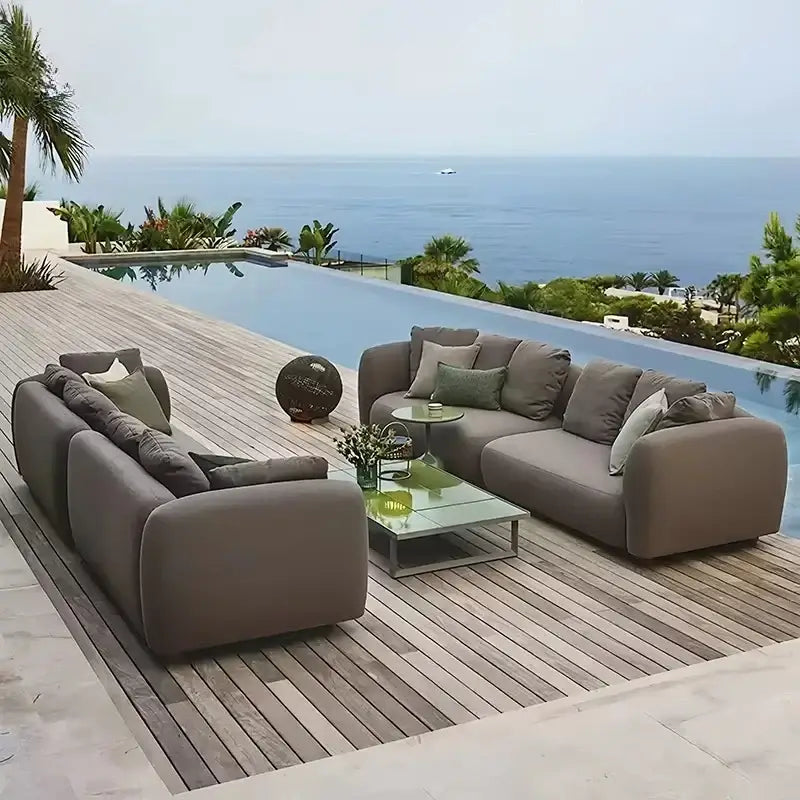 Modern gray outdoor patio sofa with waterproof cushions and fade resistant fabric detail