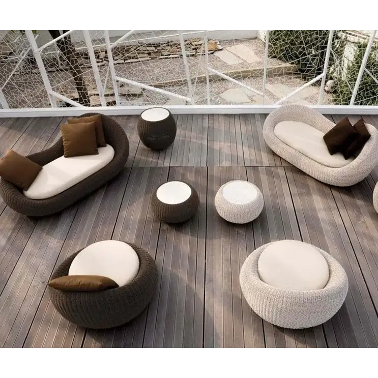Modern rattan garden sofa set in brown all-weather material, close-up detail of woven texture and craftsmanship.