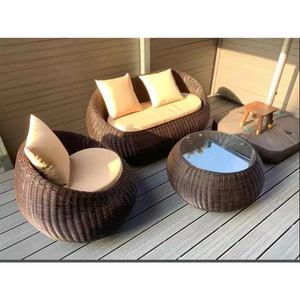 Modern rattan garden sofa set showcasing detailed weave texture and all-weather material construction in brown