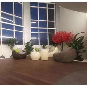 Modern rattan garden sofa set showcasing woven all-weather material detail and brown finish
