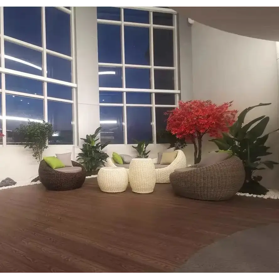 Modern rattan garden sofa set showcasing woven all-weather material detail and brown finish