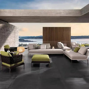 Modular L-shaped outdoor rattan sofa set featuring woven rattan material with cushioned seating and aluminum frame detail.