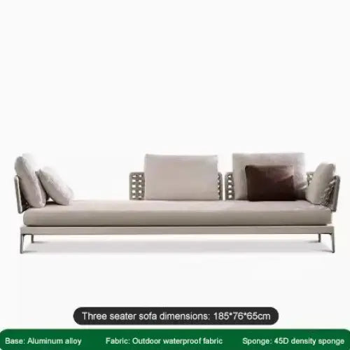 Modular rattan sofa set cushions showing woven texture and neutral beige fabric detail
