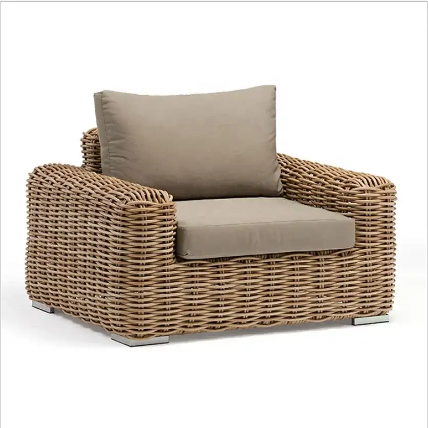 Outdoor wicker rattan sofa set close up showing natural weave texture and luxury garden furniture craftsmanship