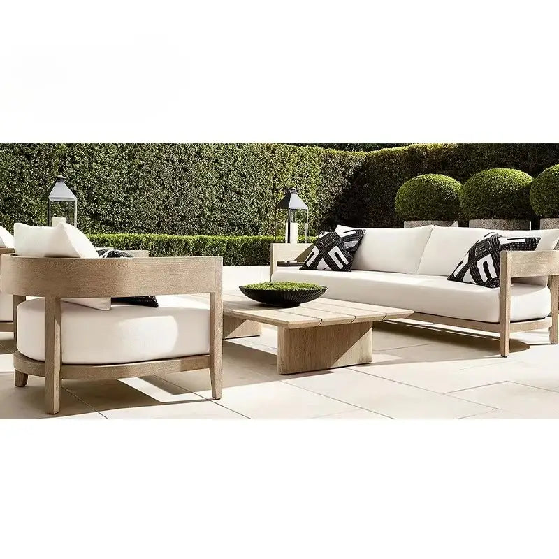 Teak wood outdoor sectional sofa showcasing dark gray modular cushions and natural wood grain detail
