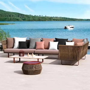 U-shape outdoor sofa set in modern rattan with cushioned seating and center table for garden furniture
