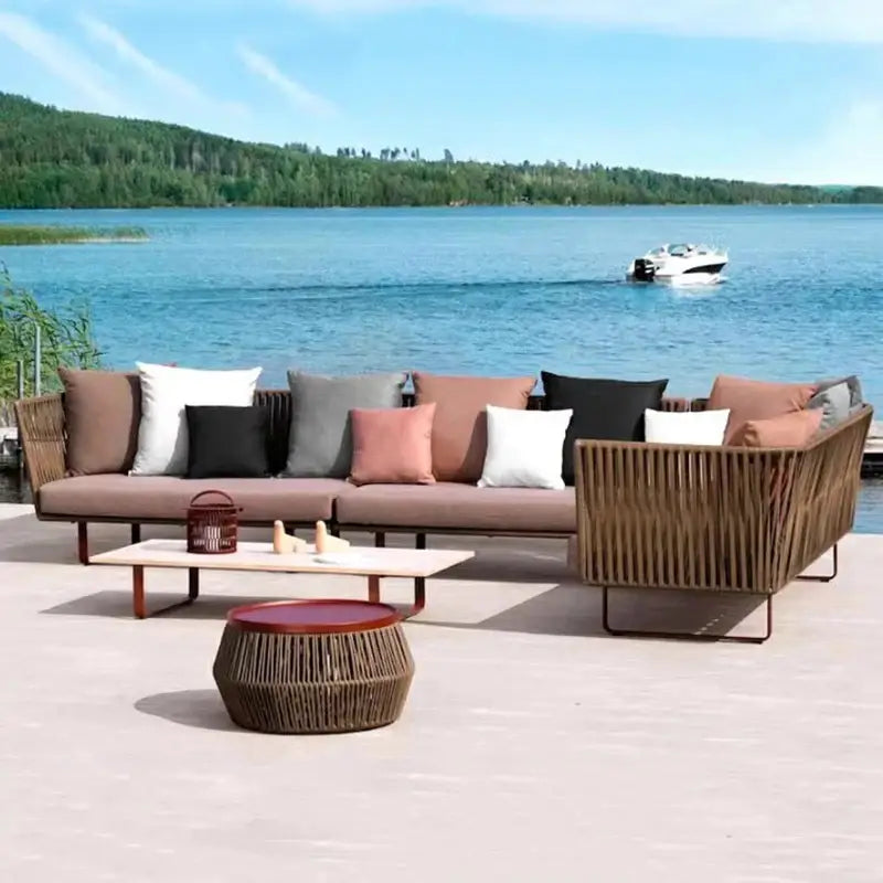 U-shape outdoor sofa set in modern rattan with cushioned seating and center table for garden furniture